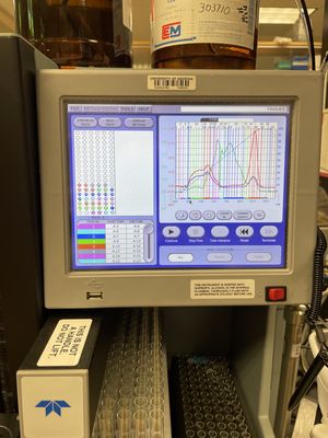 Teledyne CombiFlash flash chromatography system showing a gradient separation, above the fraction collection rack