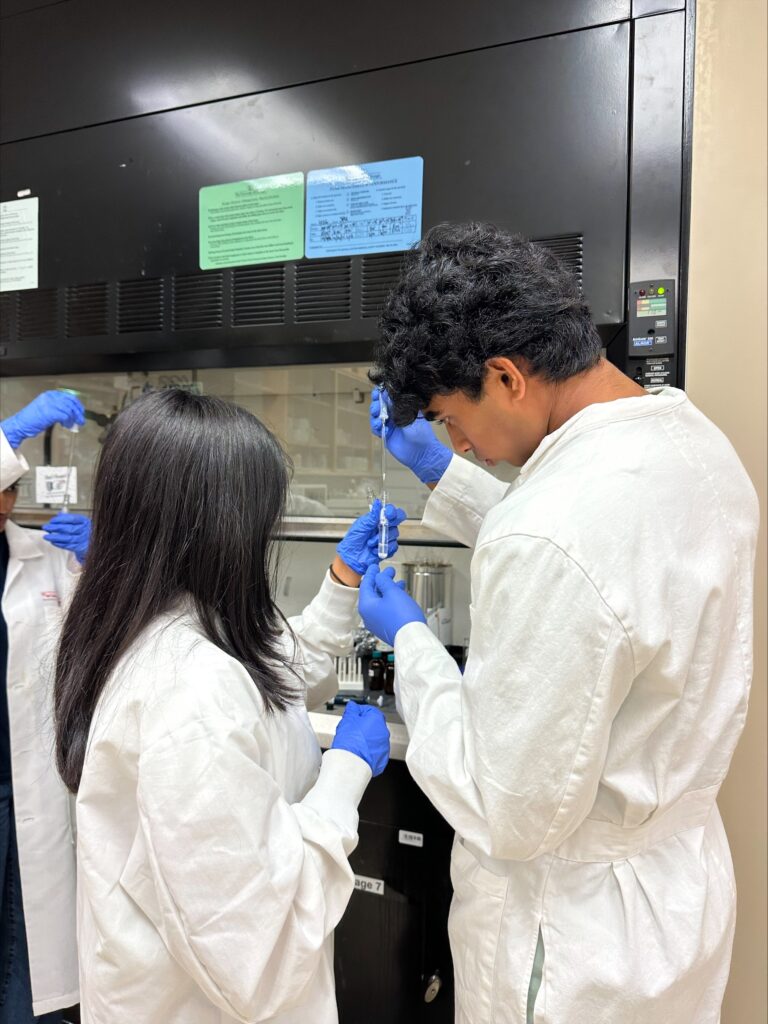 A group of people in lab coats.